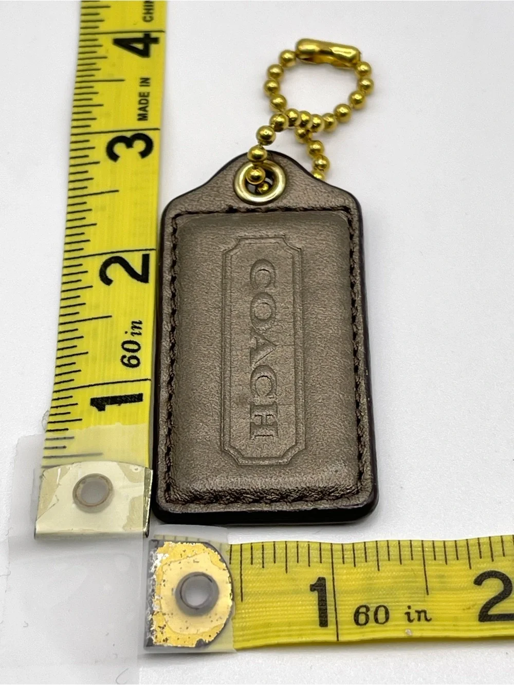 COACH Iridescent Brown Leather Hang Tag with Gold Chain